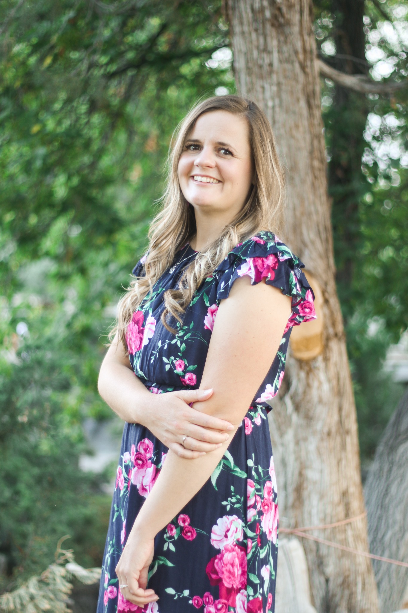 Shalese Bruce smiling outdoors beneath a tree